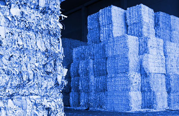Stacks of baled waste paper in a recycling center